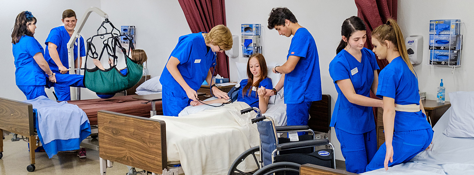 students practicing CNA skills