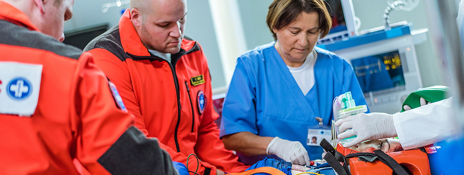 paramedic working with nurse in emergency room