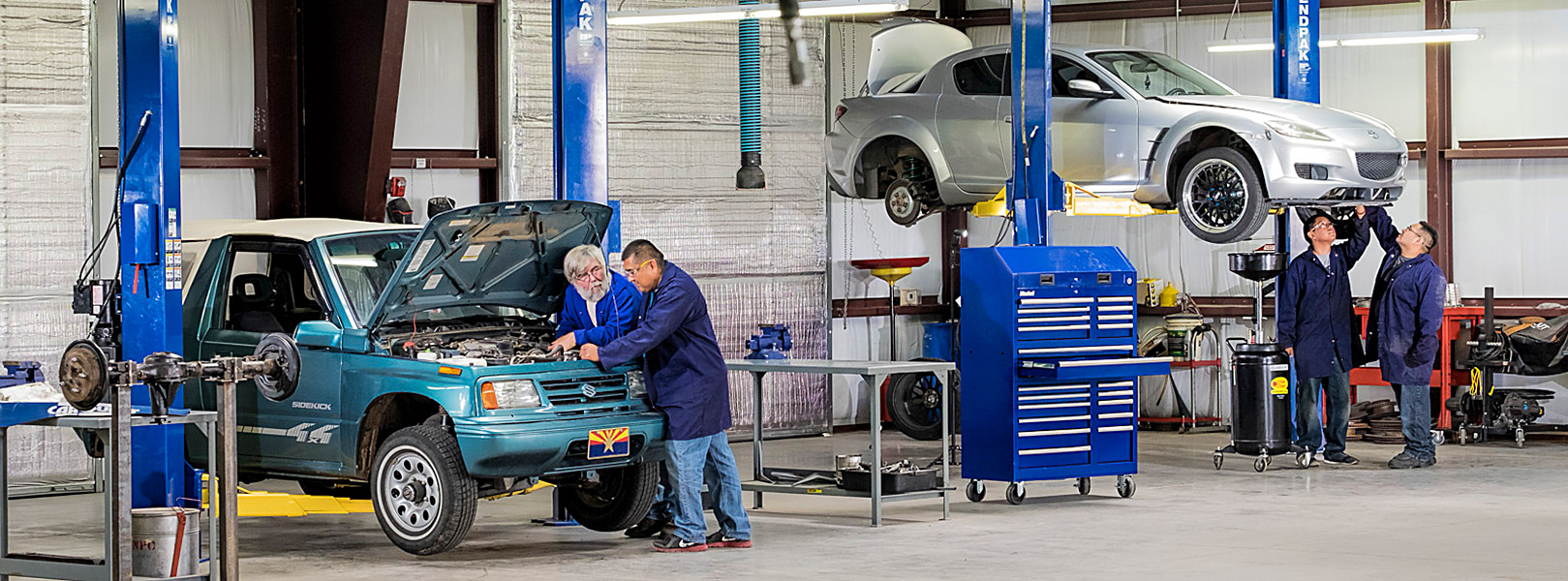 instructor and students in automotive shop