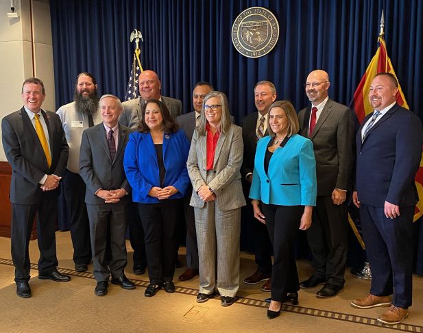 Governor Katie Hobbs pictured with leaders from AZ Community Colleges.