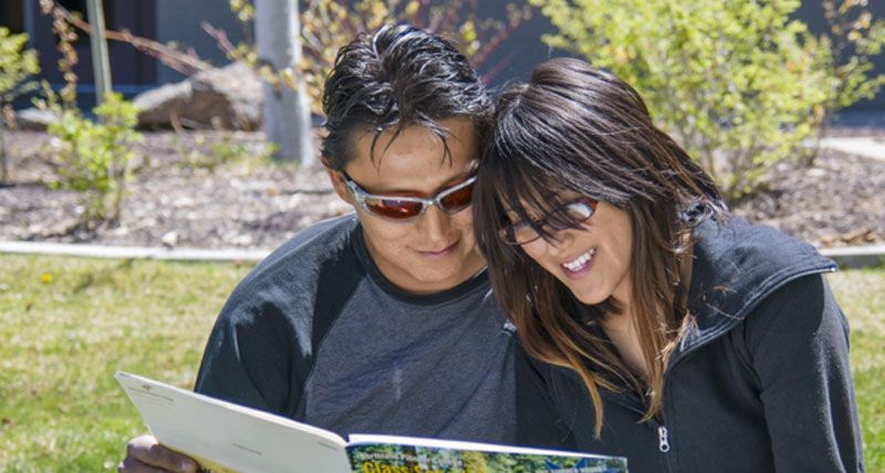 Couple looking at magazine