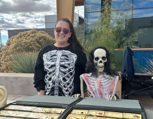 Skeletons at a booth