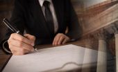 lawyer signing legal document