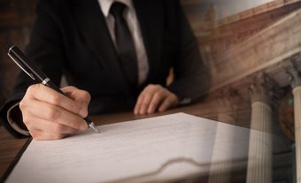 lawyer signing legal document