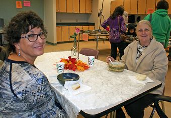 Stephanie Mecimore and Kay Soto enjoy their meal after picking out their favorite bowls to take home.