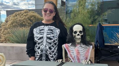 Skeletons at a booth