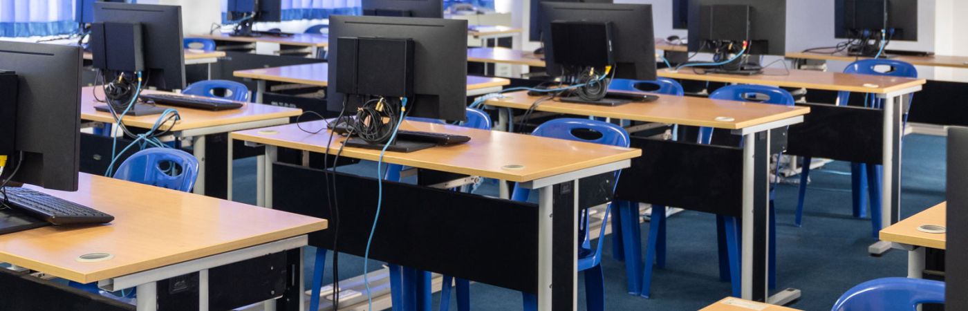 computers and chairs in classroom