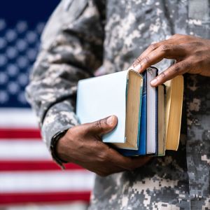 Veteran holding books